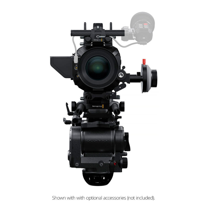 Professional video camera with various attachments on a white background