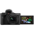 Canon Powershot V1 camera with flip-out screen displaying selfie, built-in microphone, and wide-angle zoom lens for video creators