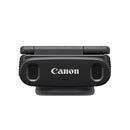 Front view of compact Canon PowerShot V10 vlog camera with built-in stereo microphones and flip screen