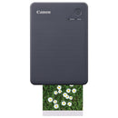 Compact black Canon Selphy QX20 wireless photo printer printing a flower photo with USB-C charging