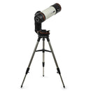 A white and black telescope with orange details, attached to a motorized mount, on a tripod.