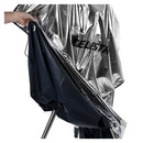 Celestron Weatherproof Telescope Cover protecting a telescope from dew, dust, and rain with aluminum-laminated fabric and adjustable drawstring