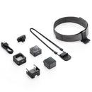 DJI Action 2 128GB Dual Screen Combo with magnetic accessories and wearable strap laid out on white background