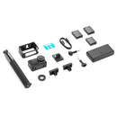 DJI Action 4 Adventure Combo with action camera, batteries, mounts, selfie stick, and accessories laid out on white background