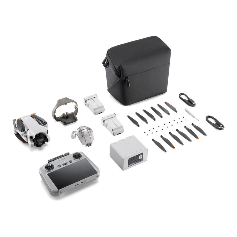 DJI Mini 4 Pro drone with remote controller, batteries, propellers, carrying case, and accessories kit