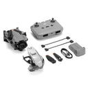 DJI Mini 5 Pro drone with remote controller, extra battery, propellers, charging cables, and protective accessories on white background