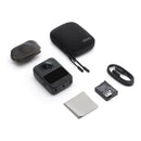 DJI Osmo 360 camera with accessories including protective case, lens cover, battery, charging cable, and cleaning cloth in white background