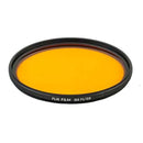Yellow camera lens filter with black frame on a white background