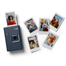 Instax camera with instant photos on a white background