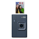 Instax camera with a photo of two people on a white background