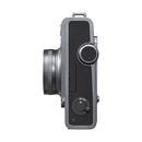 Side view of FUJIFILM instax WIDE Evo hybrid instant camera in black and gray color with lens and control dials