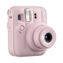 Pink instant camera on a white background