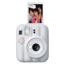 White Fujifilm instant camera with a photo of two people on a white background