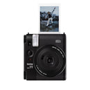 Fujifilm Instax Mini 99 instant camera in matte black with a photo print emerging