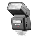 Godox iT32 Mini Flash with X5 wireless trigger mounted on camera, showcasing modular lighting system for versatile photography use.