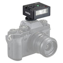 Godox iM30 compact on-camera flash mounted on mirrorless camera with adjustable power levels and replaceable batteries