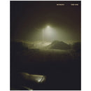 Todd Hido Outskirts Remastered 2021 Edition art photography book cover with dimly lit streetlamp and dark surroundings
