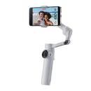 Insta360 Flow 2 smartphone stabilizer with 3-axis gimbal, built-in selfie stick and tripod, shown holding a phone capturing a selfie.