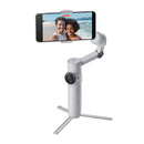 Insta360 Flow 2 smartphone stabilizer with 3-axis gimbal, built-in tripod, and AI-powered tracking holding a phone displaying a selfie video.