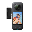 Insta360 X3 camera with attached Insta360 X3 Quick Reader storage module for fast file transfer
