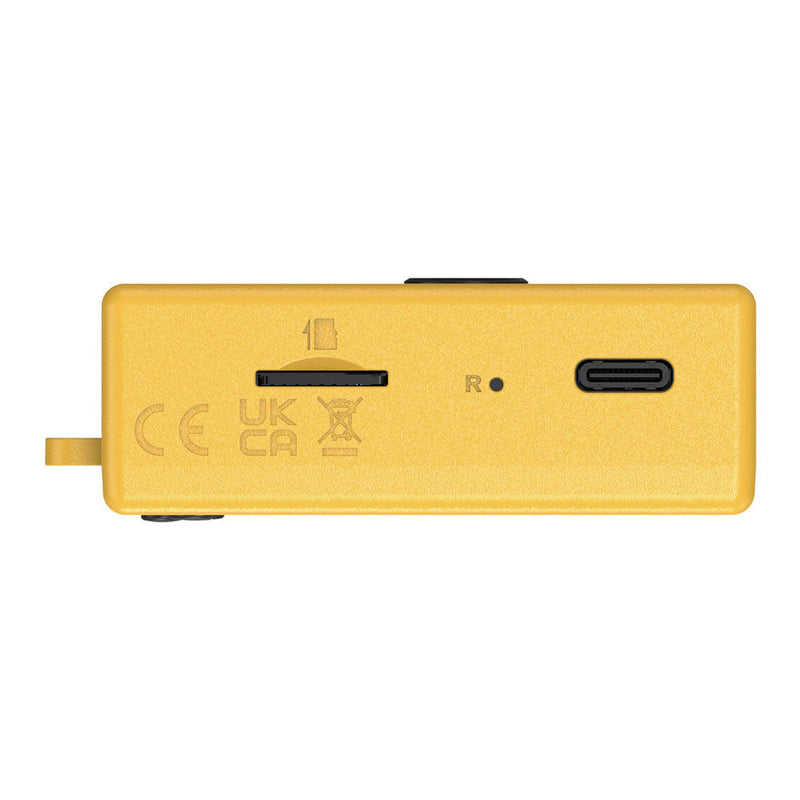Yellow Kodak Charmera keychain digital camera side view showing microSD slot and USB-C port in blind box design