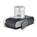 Leica M11 camera in black half-case protector with battery and SD card access.