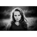 Black and white portrait of a woman with a Twist 60 Lensbaby swirl bokeh effect background
