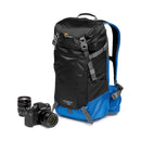 LowePro PhotoSport Outdoor Backpack 15L AW III black and blue lightweight weather-resistant camera backpack with adjustable straps and hydration pocket next to camera and lens