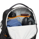 Open LowePro Fastpack BP 150 AW IV backpack with items including a blue garment, black mouse, wallet, and headphones.