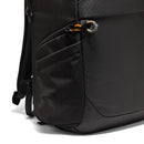 Close-up of a black Lowepro Fastpack BP 450 AW IV backpack showing the side pocket with an orange and grey zipper pull.