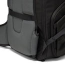 Close-up of the side and back corner of a black Lowepro Fastpack BP 450 AW IV backpack, showing padded waist straps tucked away on a white background.