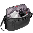 Manfrotto Advanced Hybrid Backpack open showing padded camera compartment with DSLR, clothing, and storage pockets