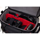 Open Manfrotto Pro Light Cineloader Small camera bag with red padded dividers and professional video equipment inside
