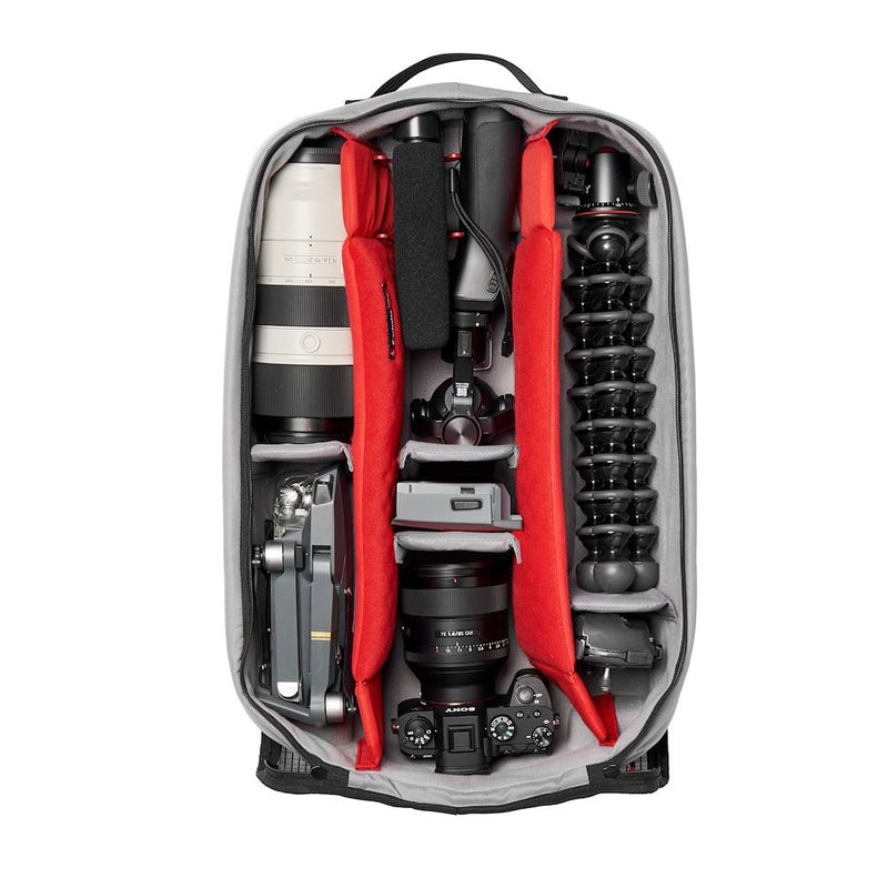 Camera case with camera equipment including lenses and a camera body on a white background