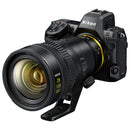 Nikon camera with Nikkor Z 28-135 f4 PZ power zoom lens attached, showing lens details and ergonomic design for video and photography.