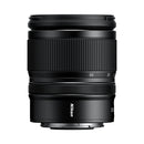 Black Nikon camera lens on a white background