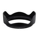 Black camera lens hood on a white background