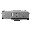 Nikon Z f silver edition camera body top view showing battery and memory card compartment
