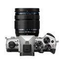 Top view of OM System OM-5 Mark II mirrorless camera with 12-45mm f4 PRO lens showing control dials and buttons