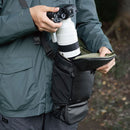 PGYTECH Camera Top Loader bag being used to hold a camera with a large lens, showcasing its expandable design and protective storage features.