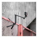 The PGYTECH MantisPod Z mounted to a fence with a GoPro attached