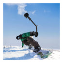 A snowboarder uses the PGYTECH MantisPod Z with a GoPro to capture selfie-ngle video