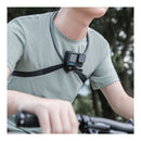 A person riding a bicycle, wearing a PGYTECH CapLock Neck Mount Max with a GoPro action camera