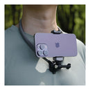 A person wearing the PGYTECH CapLock Neck Mount Max with a smartphone attached