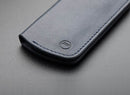 PGYTECH Memory Card Wallet in deep navy with embossed buttermilk skin and microfiber lining holding SD cards, SIM cards, wrench, and SIM pin.