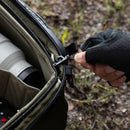 Close-up of PGYTECH OnePro Flex 30L backpack with camera insert showing zipper and interior camera gear