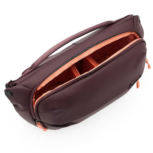 Peak Design Everyday Sling V3 10L in dark color with open main compartment showing adjustable padded dividers for organized gear storage