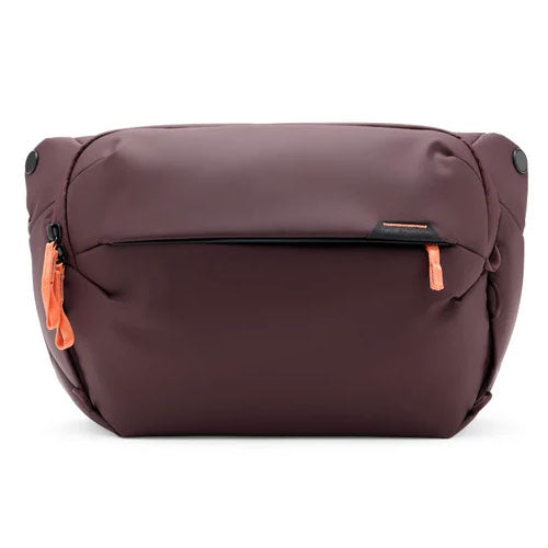 Peak Design Everyday Sling V3 10L in dark purple with orange zipper pulls, compact weather-resistant sling bag for versatile on-the-go carry and organized gear storage.
