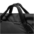 Close-up of black Peak Design Everyday Totepack 20L tote backpack handles and logo tag