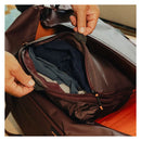 Peak Design Packing Cube Medium with tear-away zipper and expandable compartments inside suitcase